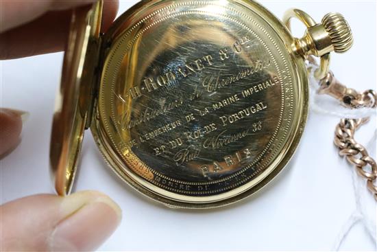 A Patek Philippe 18ct gold open face Roman dial pocket watch, cased, with 9ct gold watch chain and two swivel fob seals